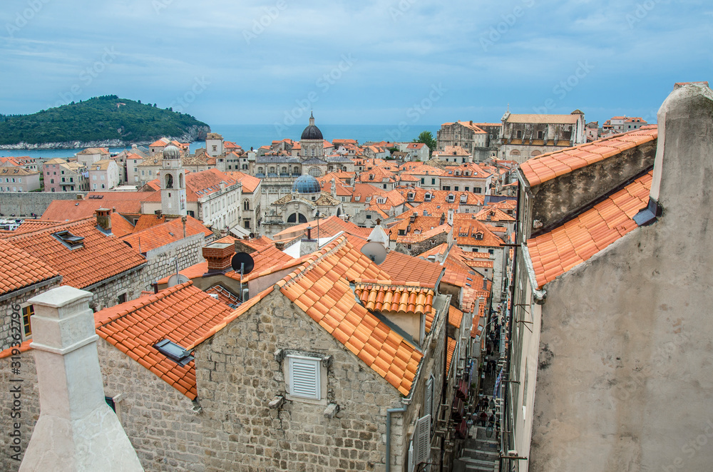 View of red rooftops and blue sea from Dubrovnik city wall, Dubrovnik, Croatia. View from above of old town center.