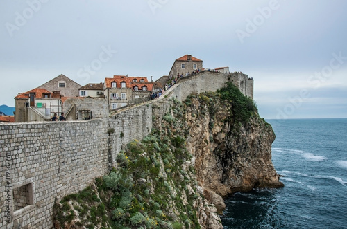 City walls of Dubrovnik Old Town  Croatia. View of the fortress walls  rocky coast and blue sea  Dubrovnik  Croatia