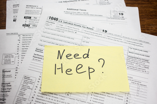 Need help text on sticker with blank 1040 tax return U.S. IRS form. Tax season.