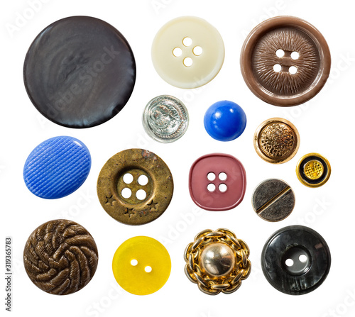 Set of a multiple old sew-through cloth buttons isolated on the white background
