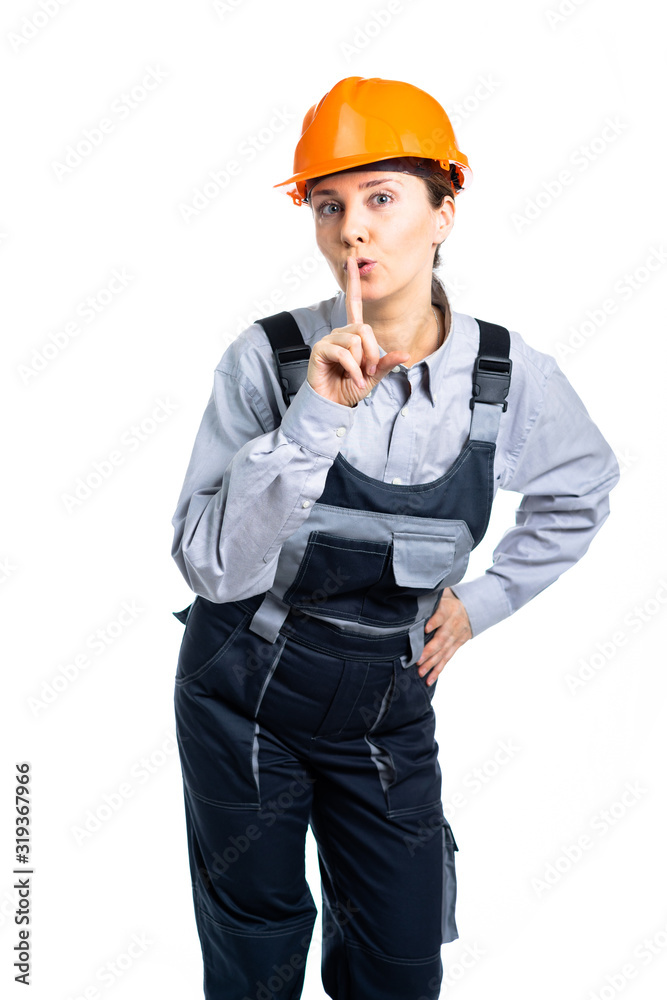 The woman in construction clothes shows a gesture with his hands. Everyone is quiet. The woman in construction clothes shows a gesture with his hands. Everyone is quiet.