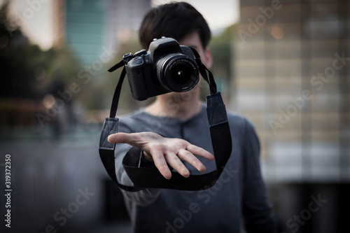 Photographer showing absolute control of his camera through levitation