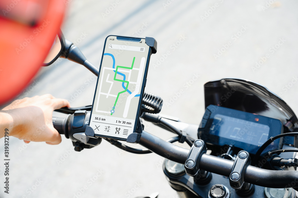 GPS APP screen smartphone installed at motorcycle handle bar for navigator.