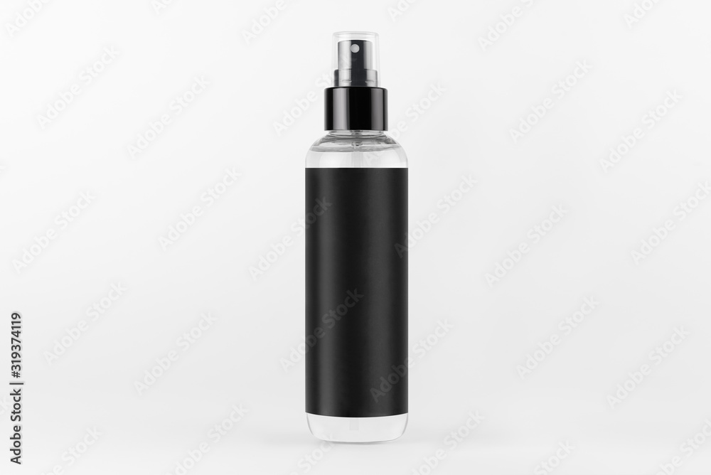 Tall transparent spray dispenser bottle for cosmetics product with black label on white background, mock up for branding, advertising, presentation, design. Tall transparent spray dispenser bottle for cosmetics product with black label on white background, mock up for branding, advertising, presentation, design.