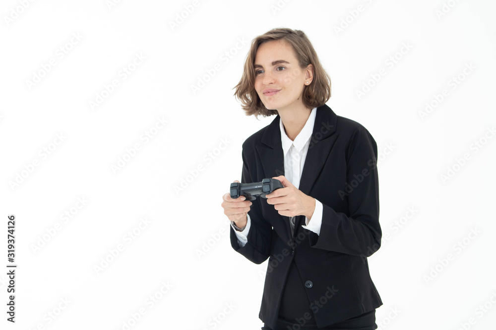 Young business woman is playing a video game on white isolated background. Young business woman is playing a video game on white isolated background.