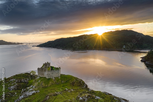 Aerial drone shot of Castle Tioram, Scottish Highlands. photo