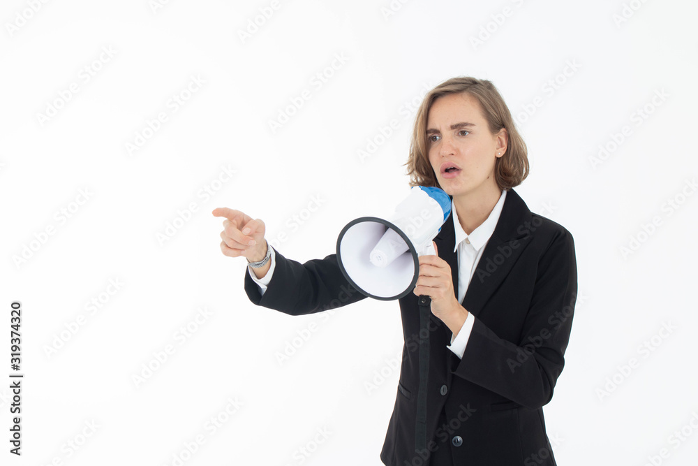 Young business woman is shouting through a megaphone on white isolated background. Young business woman is shouting through a megaphone on white isolated background.