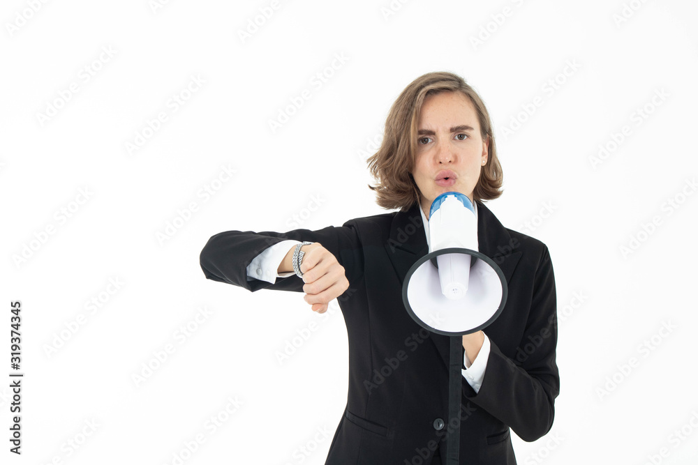 Young business woman is shouting through a megaphone on white watching her watch. Young business woman is shouting through a megaphone on white watching her watch.