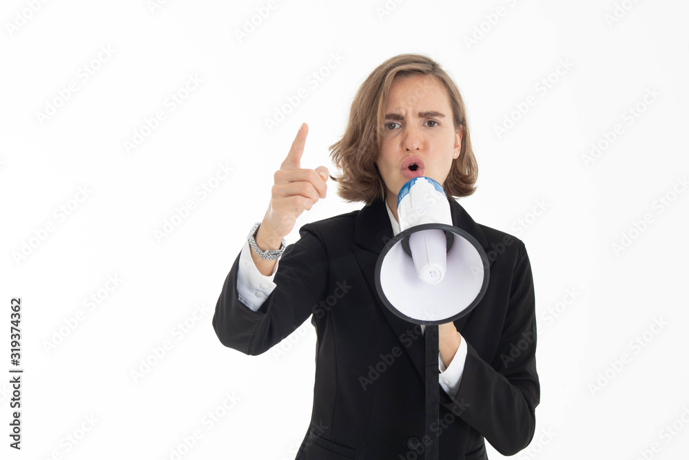 Naklejka premium Young business woman is shouting through a megaphone on white isolated background.