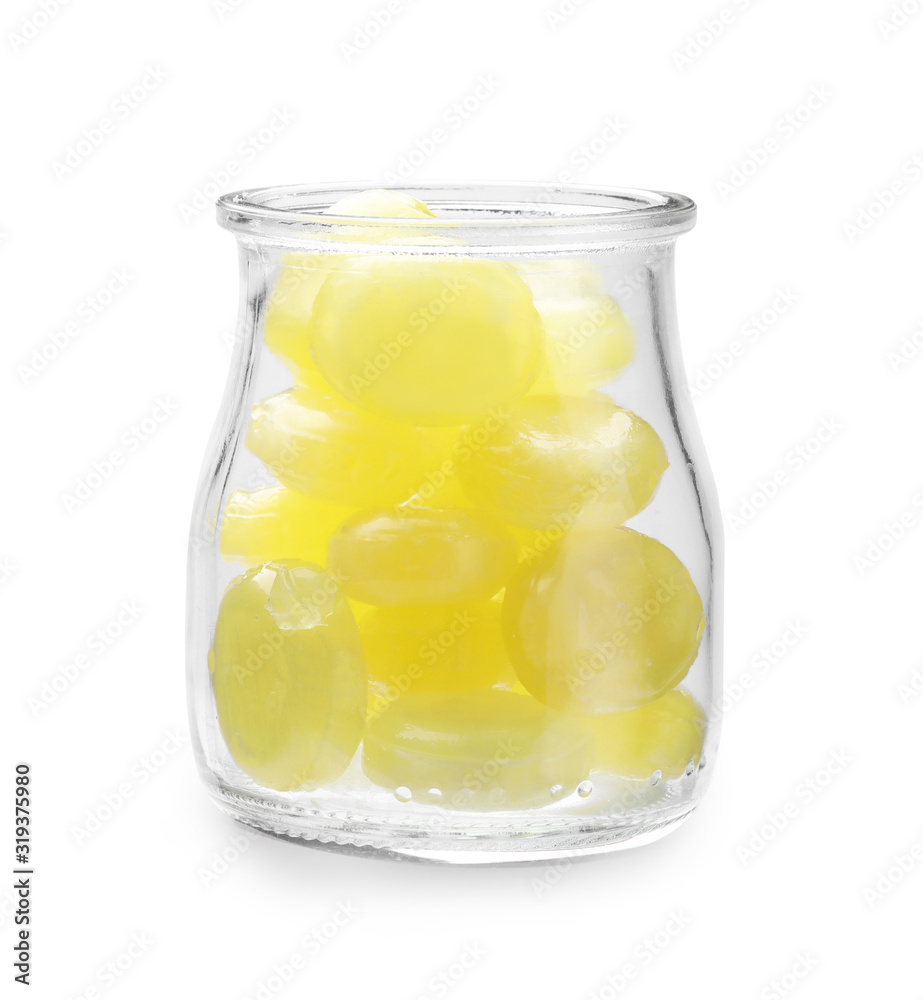 Tasty small lemon drops in glass jar isolated on white Tasty small lemon drops in glass jar isolated on white
