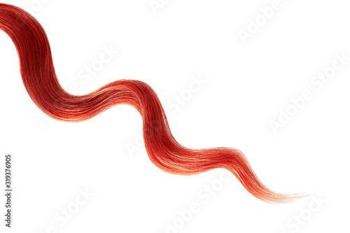 Red hair on white background, isolated. Thin curly thread