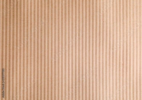 Brown corrugated sheet of cardboard as background, top view