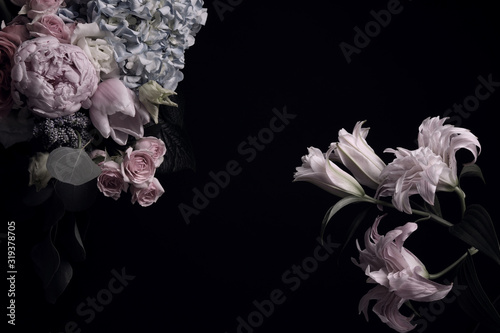 Beautiful bouquet of different flowers on black background, space for text. Floral card design with dark vintage effect © New Africa