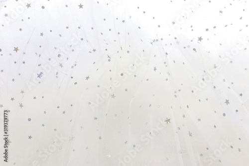 Vintage white tulle chiffon with silver sparkle stars texture background. wedding concept