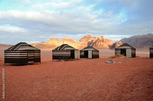 Canvas-taulu Bedouin nomad tent camp at sunrise. Wadi Rum Desert,  Jordan