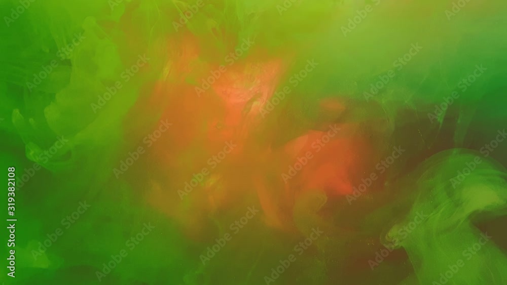 A beautiful mixture of acrylic ink in water. Ink streams of rainbow colors form abstract clouds when mixed. Acrylic clouds on a white background. Slow motion