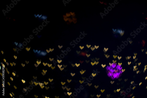 bokeh and blur abstract heart shape love valentine colorful night light on wall