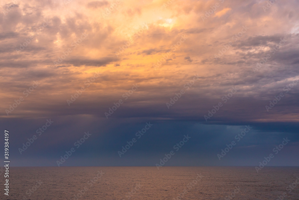 Pink Sky Over the Ocean. Beautiful sky over the Ocean with several colors. Colorful dramatic sky with morning sunshine. Nature background