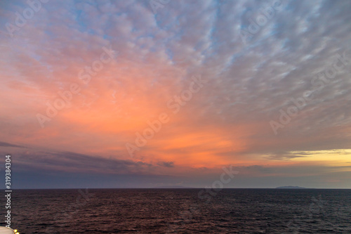 Pink Sky Over the Ocean. Beautiful sky over the Ocean with several colors. Colorful dramatic sky with morning sunshine. Nature background