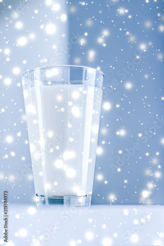 Photography Magic holiday drink, pouring organic lactose free milk into glass on marble tabl