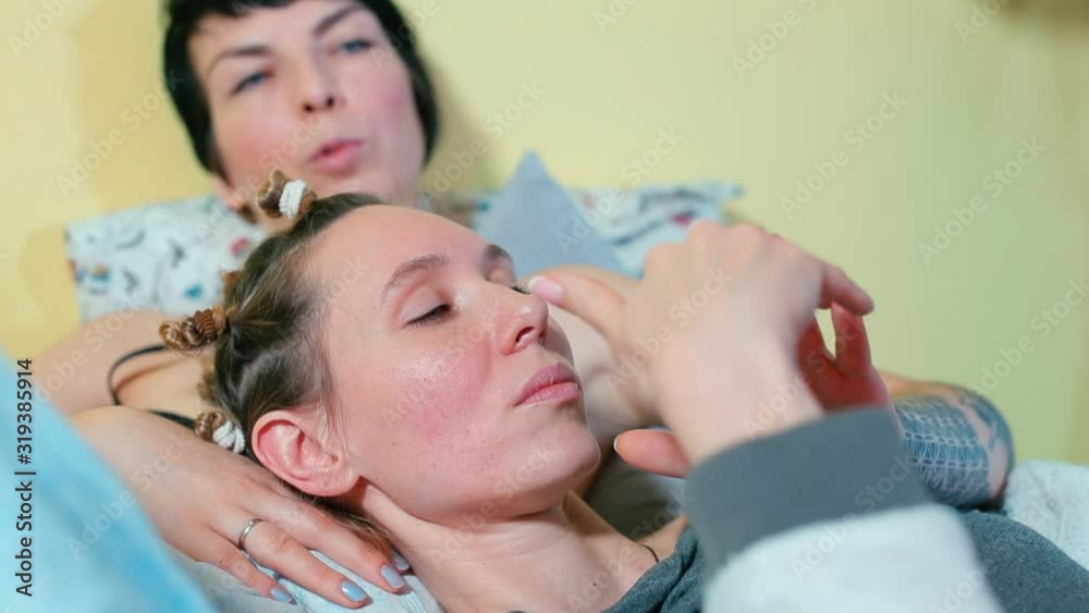 Two female LGBT partners are lying on the bed and talking, Two female LGBT partners are lying on the bed and talking,