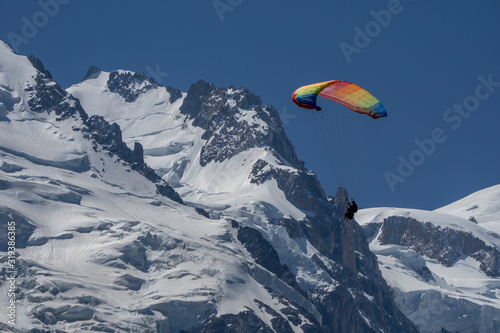 Paragliders looking for thermals amongst the snow caps of the Monte Blanc Massif, Chamonix, France