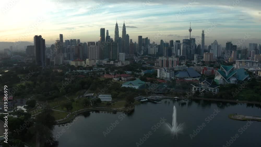 Aerial view of skyscrapers and buildings in Kuala Lumpur, Malaysia city skyline, day light. Photo with noise from action camera Aerial view of skyscrapers and buildings in Kuala Lumpur, Malaysia city skyline, day light. Photo with noise from action camera