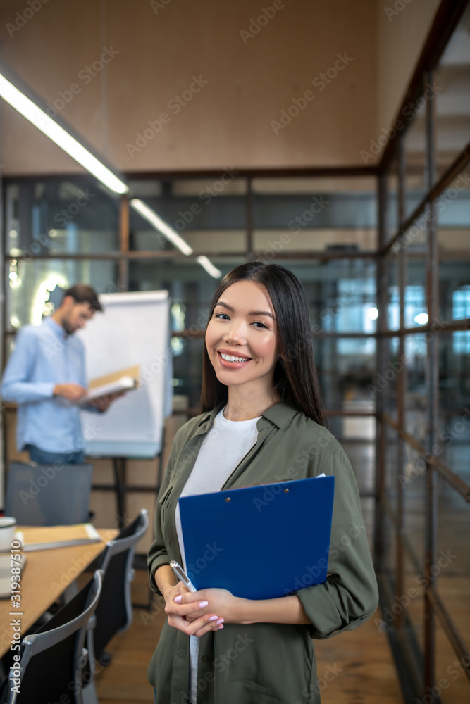 Fototapeta premium Asian young businesswoman with long hair looking contented