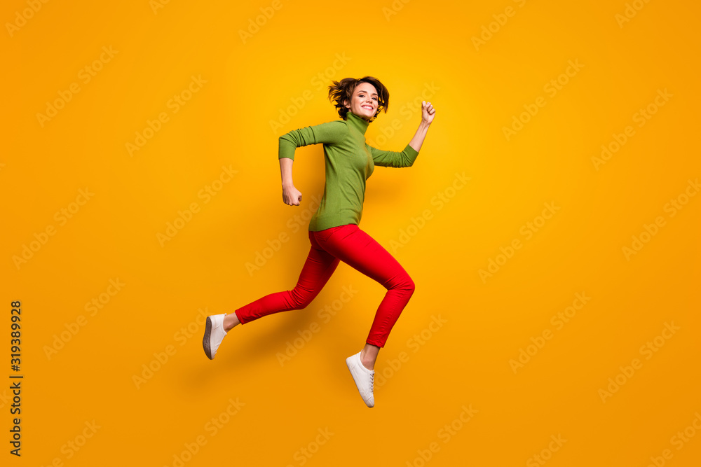 Full length profile side photo of cheerful enthusiastic girl jump run after fall spring season discounts wear casual style clothing isolated over bright color background