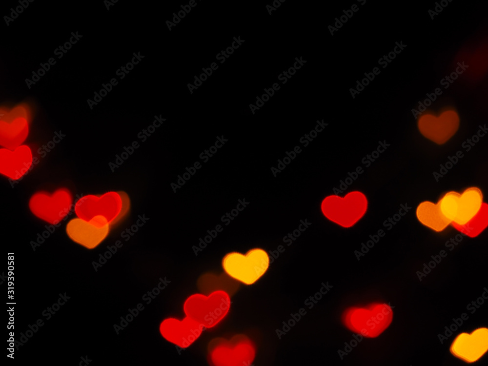 Red heart shaped bokeh on black background. Valentine's day,love,anniversary concept..