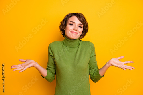 I don't know. Photo of beautiful lady spread hands shrug shoulders careless ignorance expression said bad wrong thing wear casual green turtleneck isolated yellow color background photo