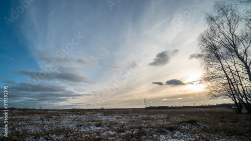 Beautiful setting sun over frozen field © Ni23