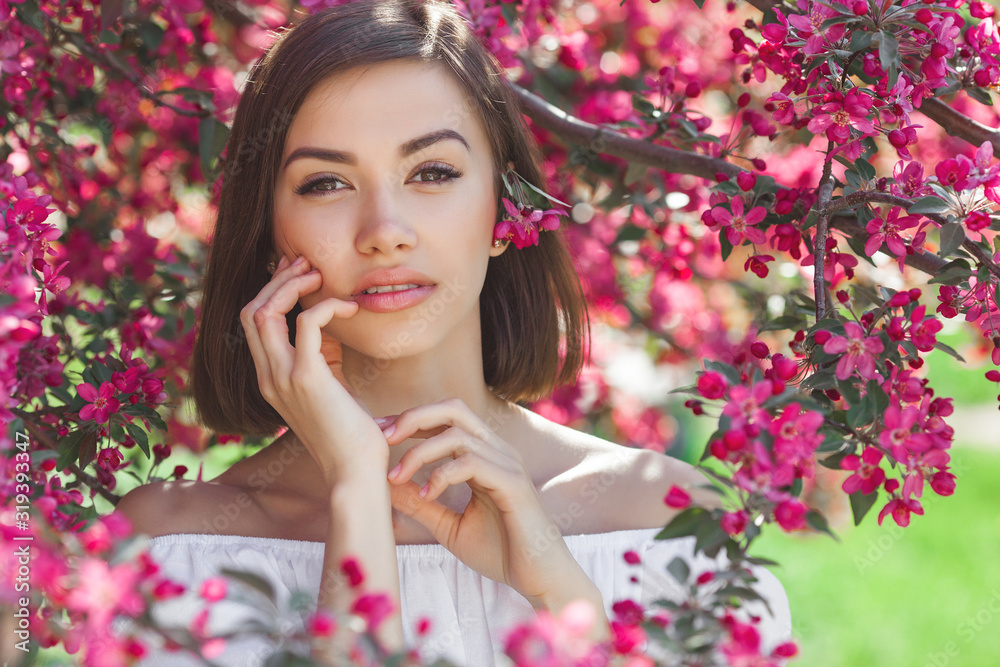 Beautiful lady on floral background. Woman with flowers. Poretait of gorgeous female in pink flowers. Beautiful lady on floral background. Woman with flowers. Poretait of gorgeous female in pink flowers.