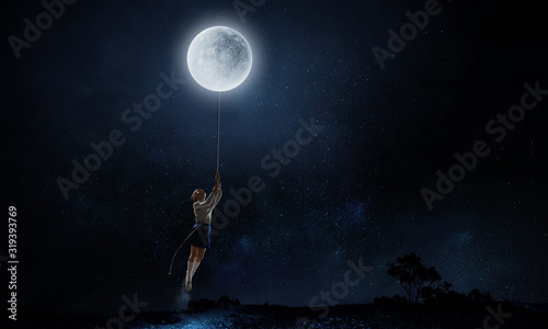Kid girl catching moon. Mixed media