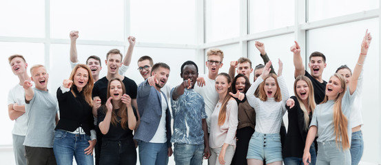 team of happy young people standing together