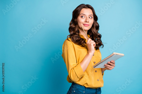 Profile side view portrait of her she nice attractive lovely cheerful curious wavy-haired girl creating notes love story isolated on bight vivid shine vibrant green blue turquoise color background photo