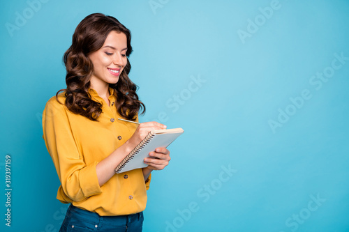 Portrait of her she nice attractive lovely pretty charming cheerful cheery wavy-haired girl making writing notes isolated over bright vivid shine vibrant green blue turquoise color background