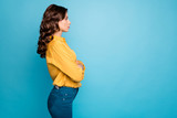 Profile photo of amazing curly business lady hold hands crossed seriously looking colleagues dislike coming work late wear yellow shirt trousers isolated blue color background