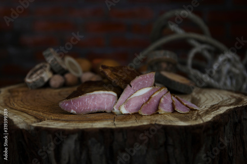 Prosciutto Served on a Rustic Wooden Surface. Smoked Cured Ham, Delicious, Domestic, Traditional Food
