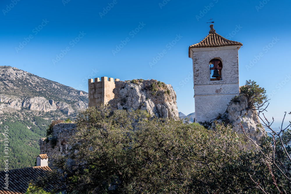 View of medieval enclosed mountain fortification El castell de Guadalest popular tourist destination near Benidorm and Alicancte in Spain