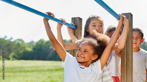 Group of children turns on a climbing frame