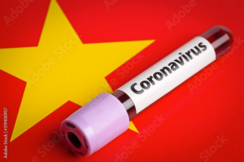 Blood sample in laboratory blood test tube with Coronavirus label on china flag macro. Epidemic Mers-CoV Coronavirus infection concept. 