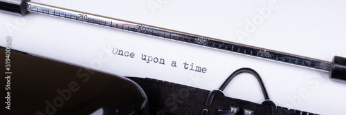 Photos Once upon a time, written with an old typewriter. Panoramic image