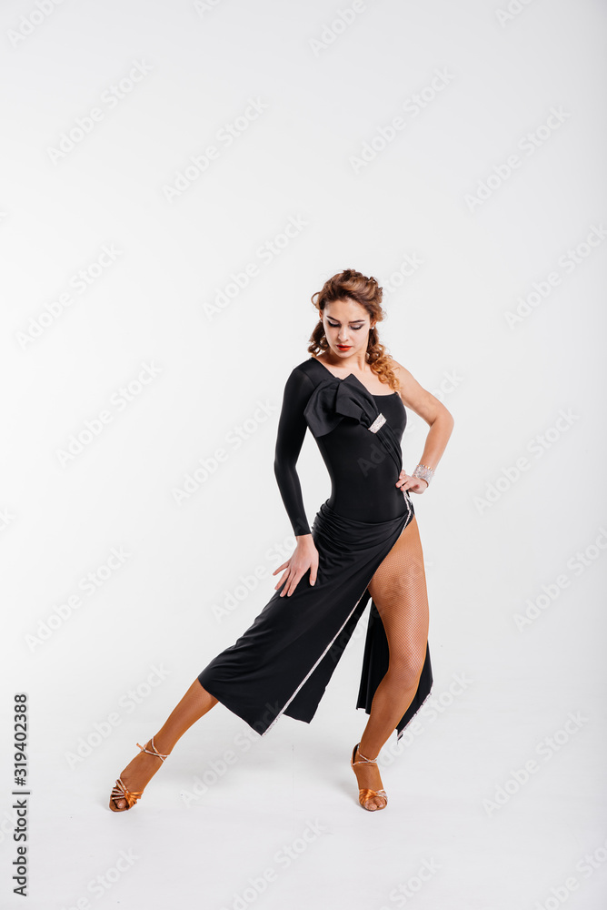 Dance school concept. Young beautiful dancer posing in studio. Dance school concept. Young beautiful dancer posing in studio.