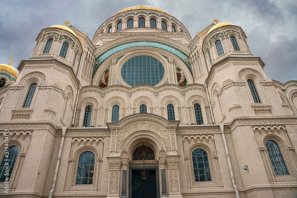 Front view of the facade of the Naval Cathedral in Kronstadt against a gray autumn sky