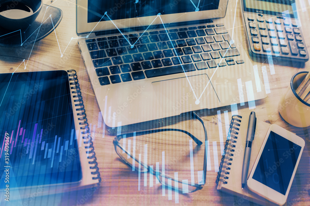 Double exposure of forex chart and work space with computer. Concept of international online trading. Double exposure of forex chart and work space with computer. Concept of international online trading.