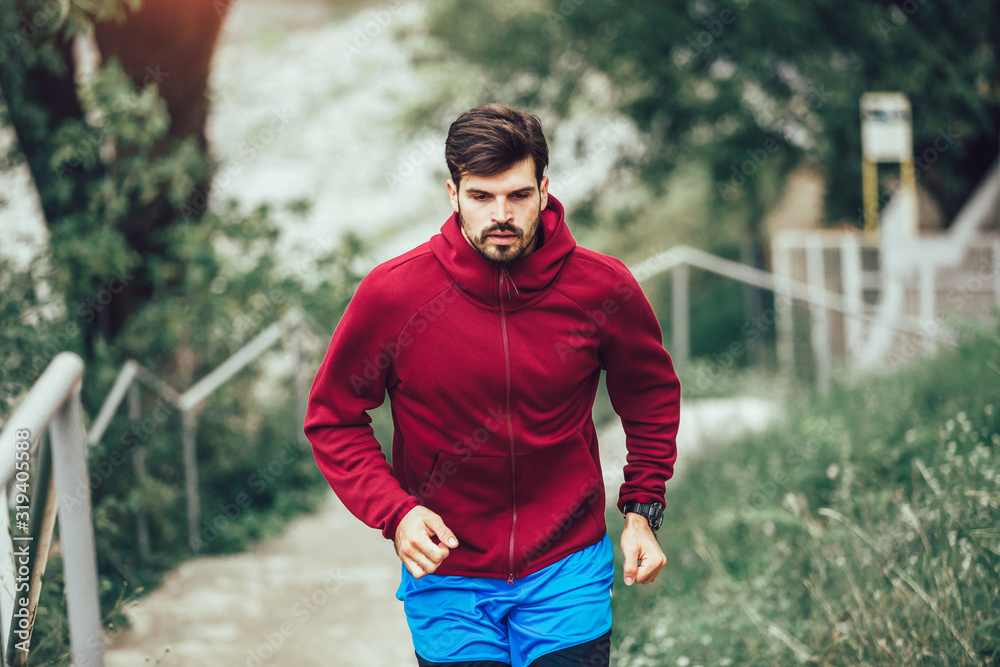 Young man running at park during morning Young man running at park during morning