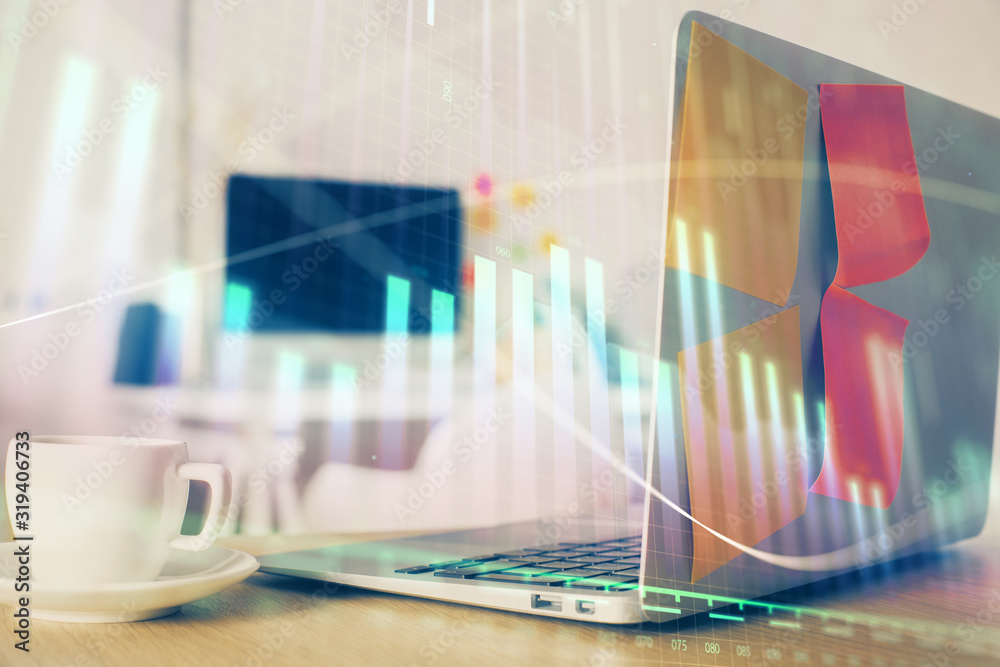 Stock market chart hologram drawn on personal computer background. Double exposure. Concept of investment. Stock market chart hologram drawn on personal computer background. Double exposure. Concept of investment.