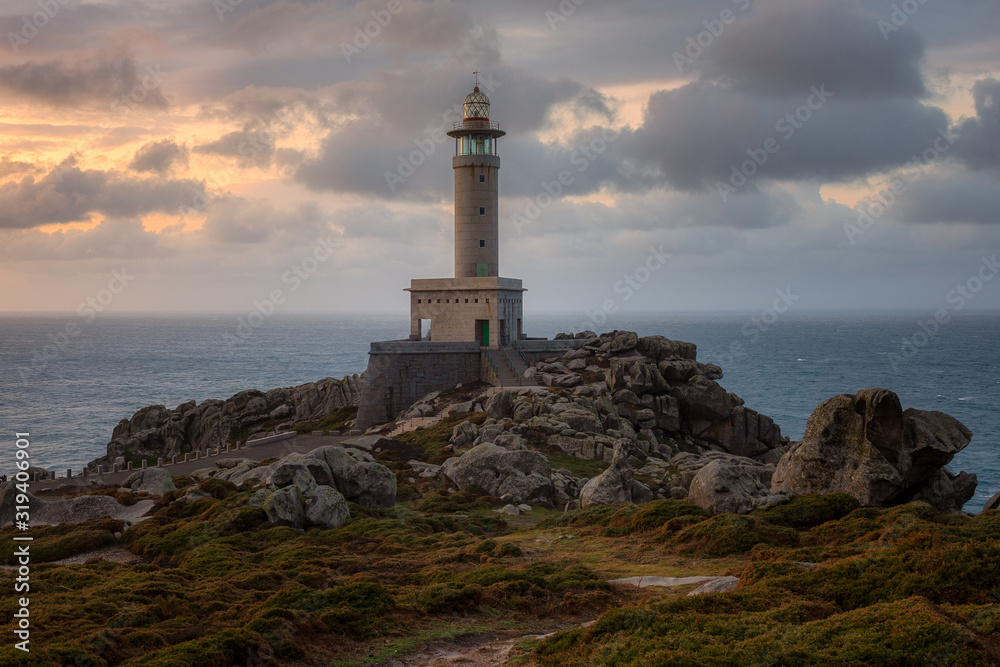 Punta Nariga lighthouse at sunset. Galicia, Spain