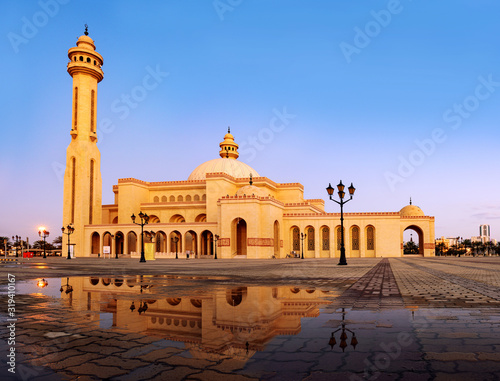 Beautiful view of Al Fateh Grand Mosques with reflection in the water on the morning, Manama Bahrain.